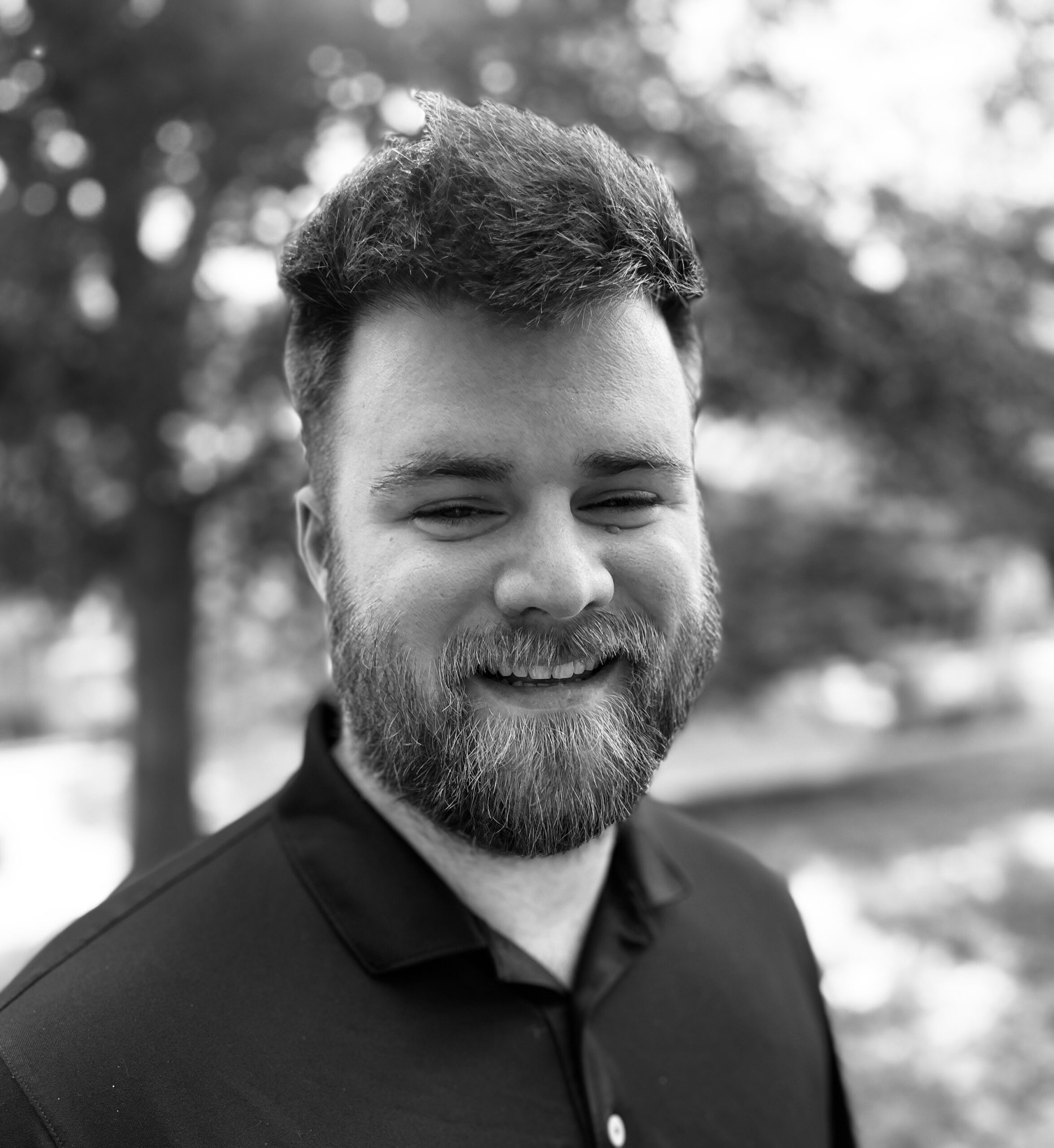 Cody England headshot black and white